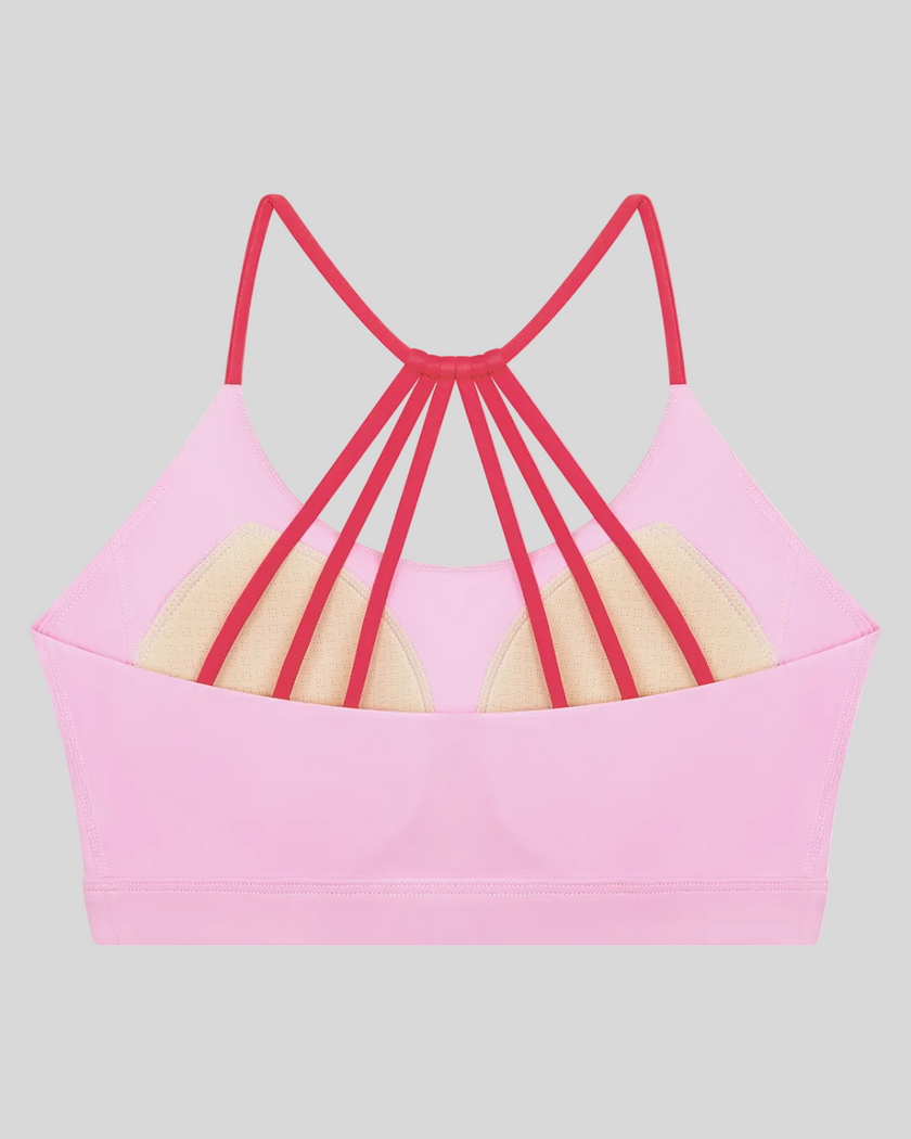 TrackLine Synergy Strappy Sports Bra in Pink with Rose Red, flat lay back view showing multi-strap design