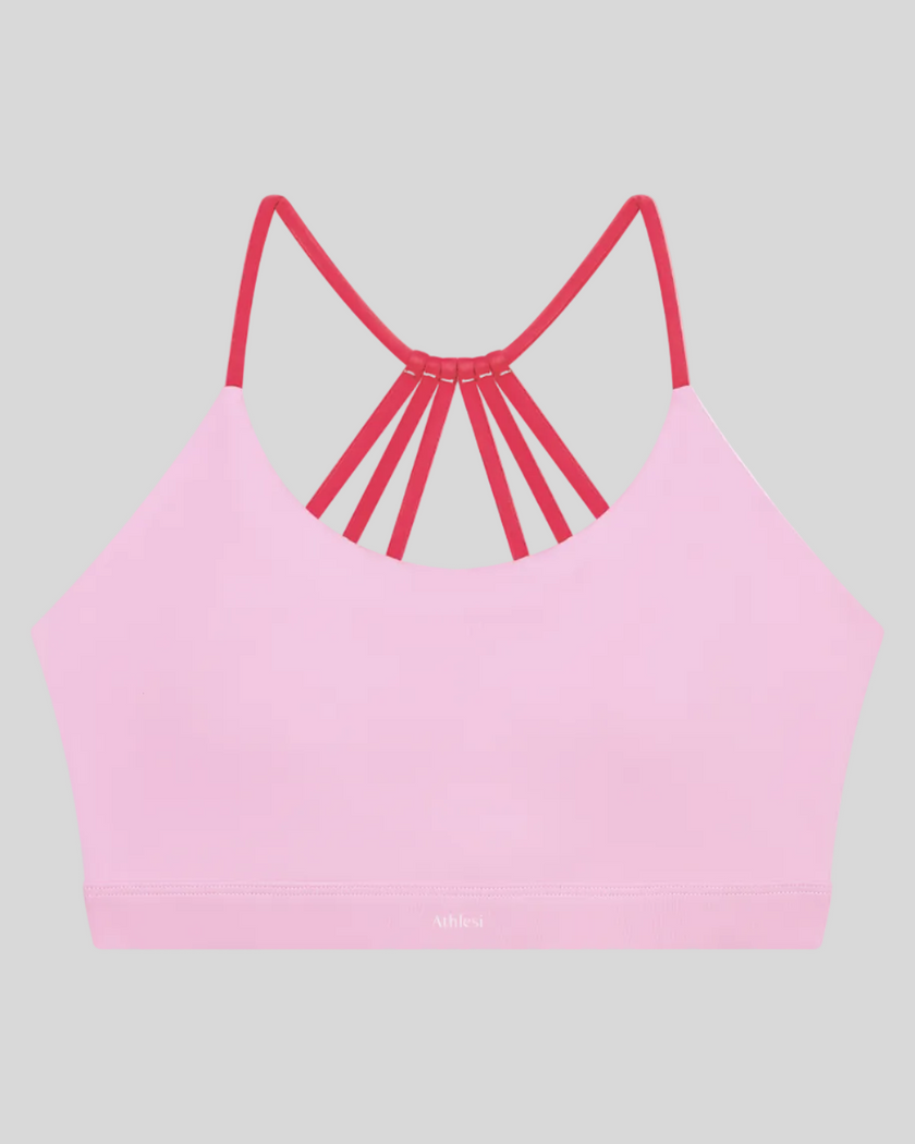 TrackLine Synergy Strappy Sports Bra in Pink with Rose Red, flat lay front view
