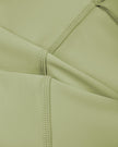 Close-up of smooth stretch fabric on TrackLine Synergy Tank Top in Bean Green