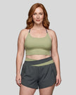 Woman wearing TrackLine Synergy Tank Top in Bean Green with Dark Gray straps, front view