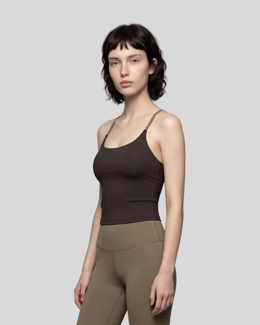 Woman wearing TrackLine Synergy Tank Top in Coffee with Khaki straps, angled front view