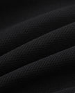 Closeup of the lightweight cotton blend fabric texture on the Athlesi TrackLine Track Shorts in black