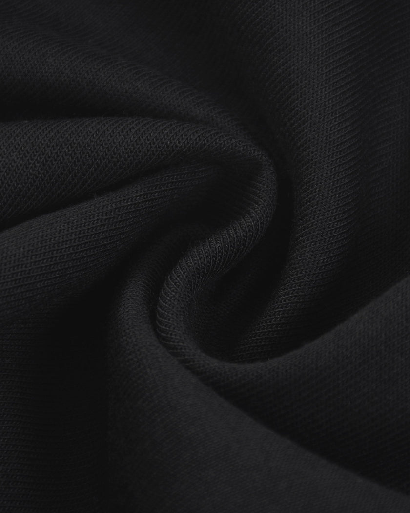 Detailed fabric texture closeup of the Athlesi TrackLine Track Shorts in black