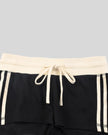 Front waistband closeup of the Athlesi TrackLine Track Shorts in black