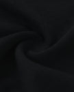Detailed fabric texture closeup of the Athlesi TrackLine V-Neck Crop Tee in black