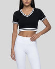 Angled front view of the Athlesi TrackLine V-Neck Crop Tee in black with retro-inspired stripe detailing