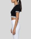 Side view of the Athlesi TrackLine V-Neck Crop Tee in black showing the cropped fitted silhouette