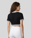 Upper body back view of the Athlesi TrackLine V-Neck Crop Tee in black