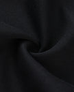 Cotton-blend fabric texture detail on the TrackLine Varsity Jacket in Black