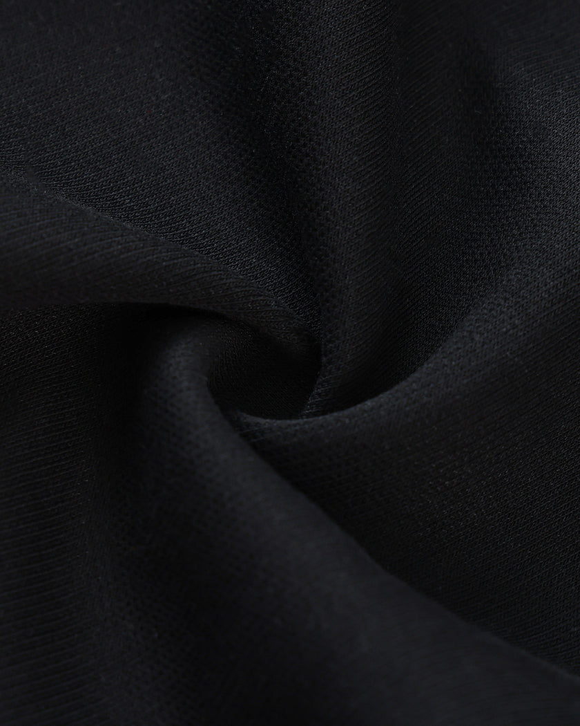 Cotton-blend fabric texture detail on the TrackLine Varsity Jacket in Black