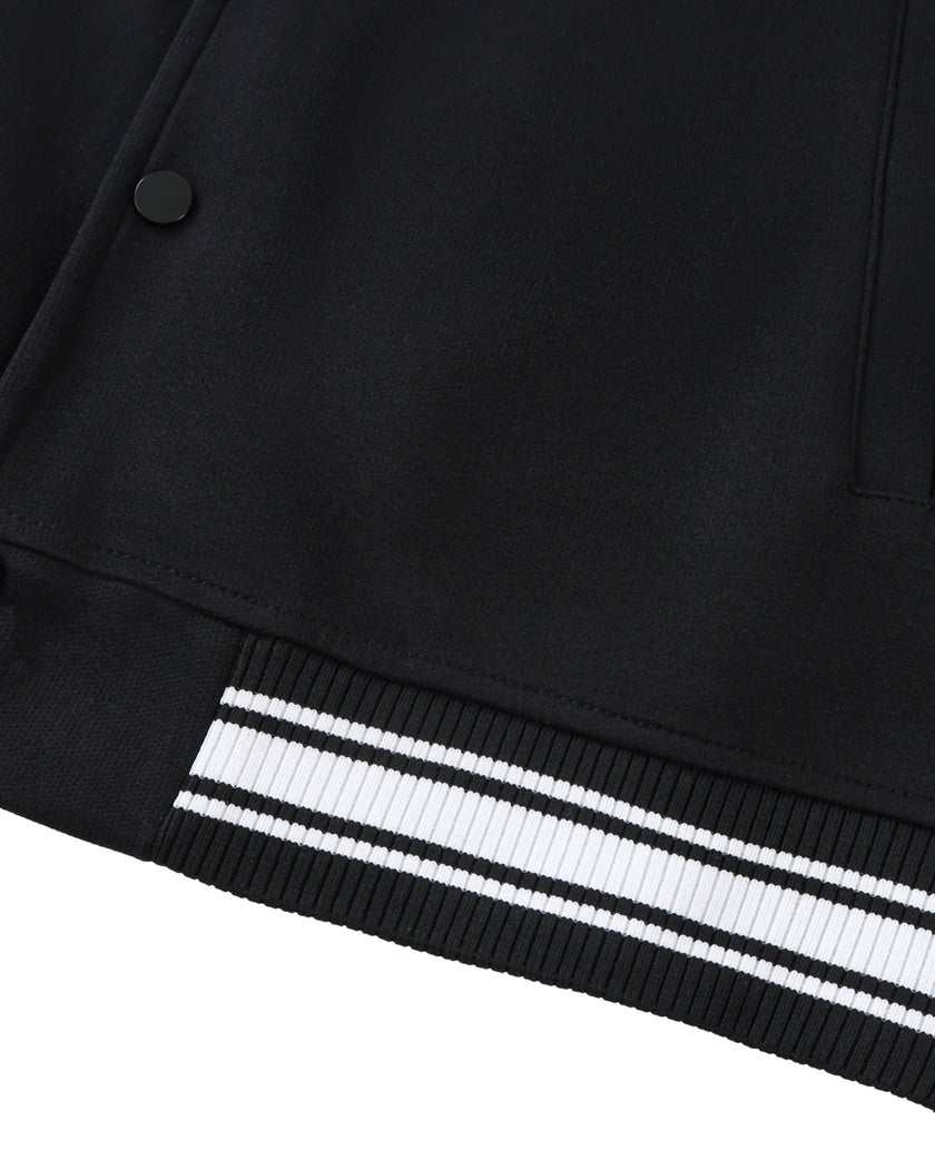Striped rib hem detail on the TrackLine Varsity Jacket in Black