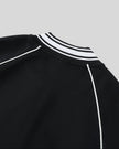 Back collar detail on the TrackLine Varsity Jacket in Black