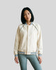 Model wearing the TrackLine Varsity Jacket in Mild Apricot fully buttoned front view