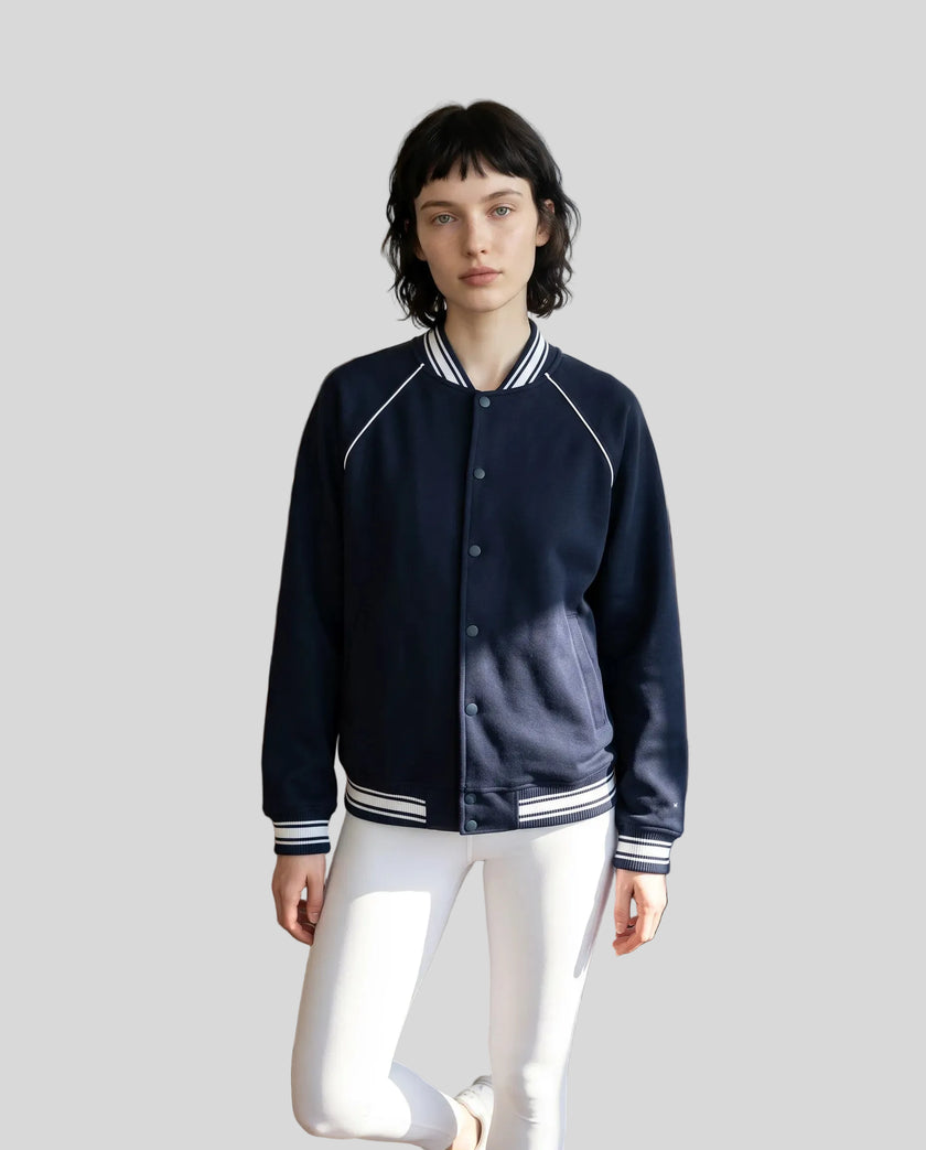 Model wearing the TrackLine Varsity Jacket in Navy Blue fully buttoned front view