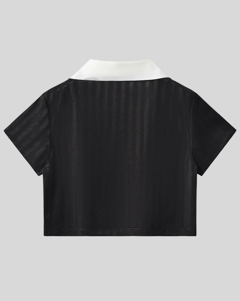 Back view of the Athlesi TrackLine Varsity Jersey in black and white