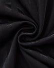 Detailed fabric texture closeup of the Athlesi TrackLine Varsity Jersey in black and white