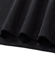Bottom hem detail closeup of the Athlesi TrackLine Varsity Jersey in black and white