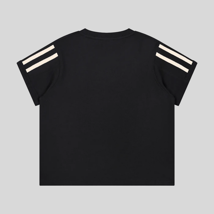 Back view flatlay of the Athlesi TrackLine Varsity Tee in black with athletic stripe sleeve detailing