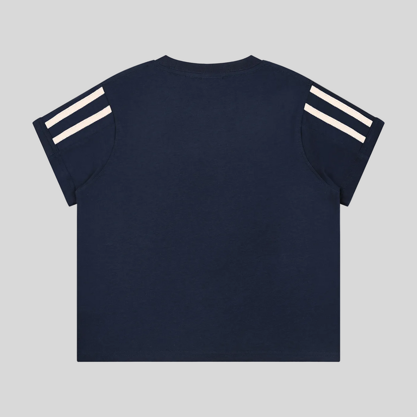 Back view flatlay of the Athlesi TrackLine Varsity Tee in blue with athletic stripe sleeve detailing