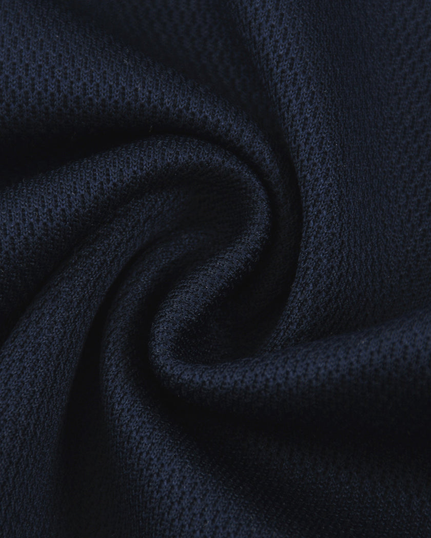 Detailed fabric texture closeup of the Athlesi TrackLine Varsity Tee in blue