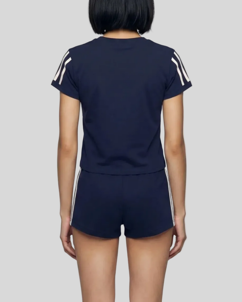 Mid body back view of the Athlesi TrackLine Varsity Tee in blue