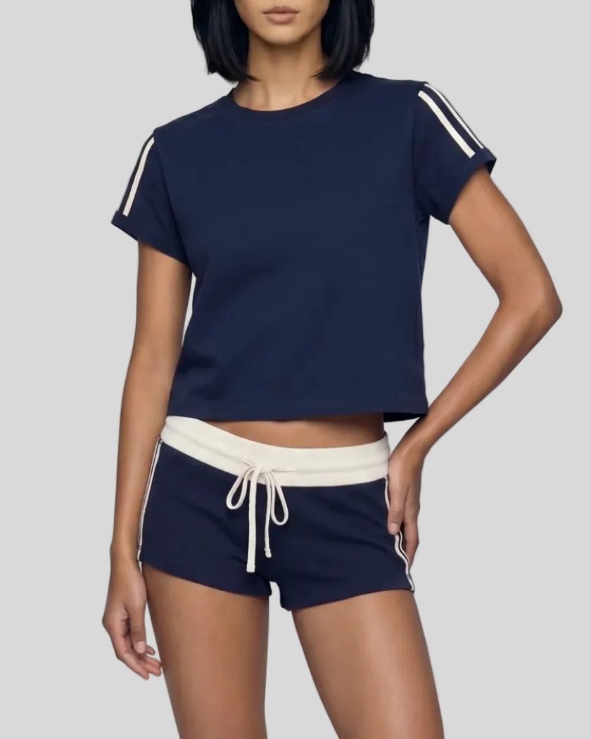 Front angled view of the Athlesi TrackLine Varsity Tee in blue with varsity stripe sleeve detailing