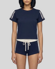 Mid body front view of the Athlesi TrackLine Varsity Tee in blue styled with matching TrackLine Track Shorts