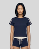Upper body front view of a woman wearing the Athlesi TrackLine Varsity Tee in blue