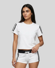 Upper body front view of a woman wearing the Athlesi TrackLine Varsity Tee in white