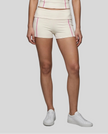 Lower body front view of woman wearing TrackLine Yoga Shorts in apricot