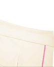 Closeup of wide high-rise waistband on TrackLine Yoga Shorts in apricot