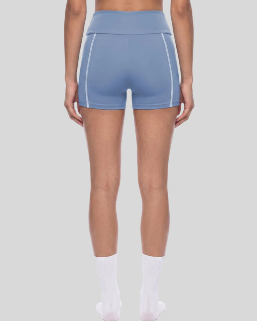 Lower body back view of woman wearing TrackLine Yoga Shorts in blue