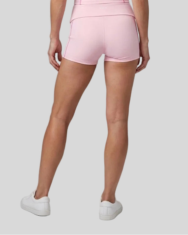 Lower body back view of woman wearing TrackLine Yoga Shorts in pink