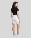 Back view of the Athlesi TrackLine Zip Crop Tee in black styled with a sport-inspired minimalist look