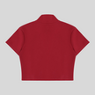 Back view flatlay of the Athlesi TrackLine Zip Crop Tee in red with contrast stripe sleeve detailing