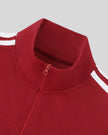 Closeup of the mock neck collar and front zipper detail on the Athlesi TrackLine Zip Crop Tee in red