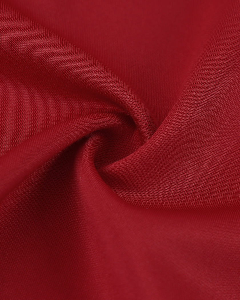 Detailed fabric texture closeup of the Athlesi TrackLine Zip Crop Tee in red