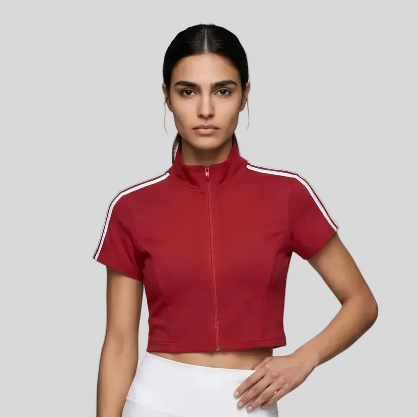 Upper body front view of the Athlesi TrackLine Zip Crop Tee in red with contrast stripe sleeve details