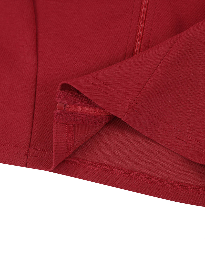 Bottom hem closeup of the Athlesi TrackLine Zip Crop Tee in red