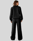 Back view of UrbanEase Collared Set in black showing clean, relaxed silhouette