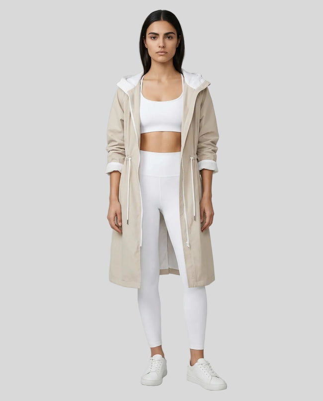 UrbanFlow Hooded Trench in dust storm worn by model full body front view styled in a clean studio setting