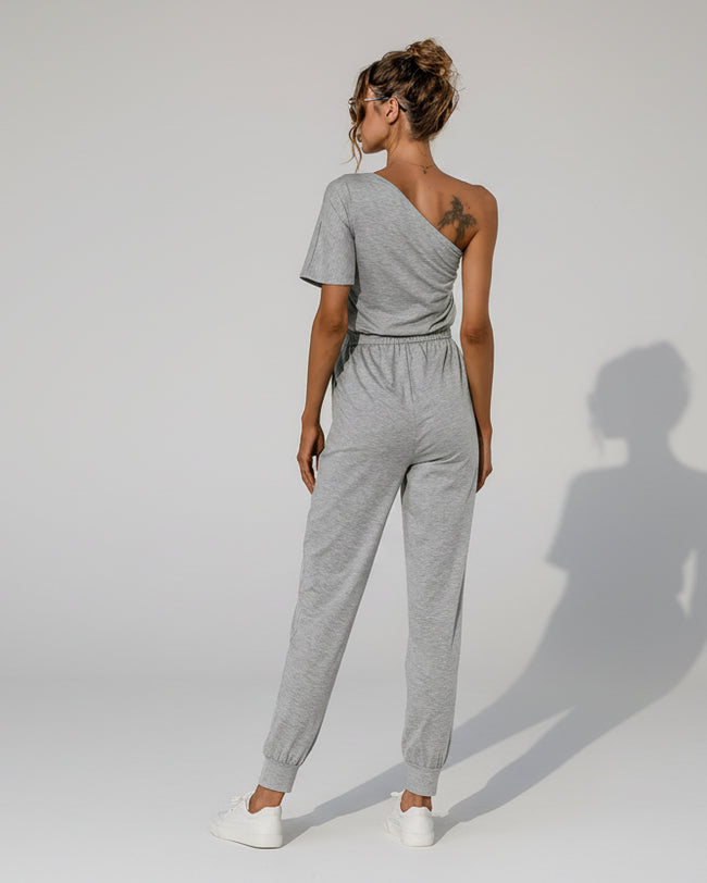 Back view of gray one-shoulder jumpsuit with relaxed fit