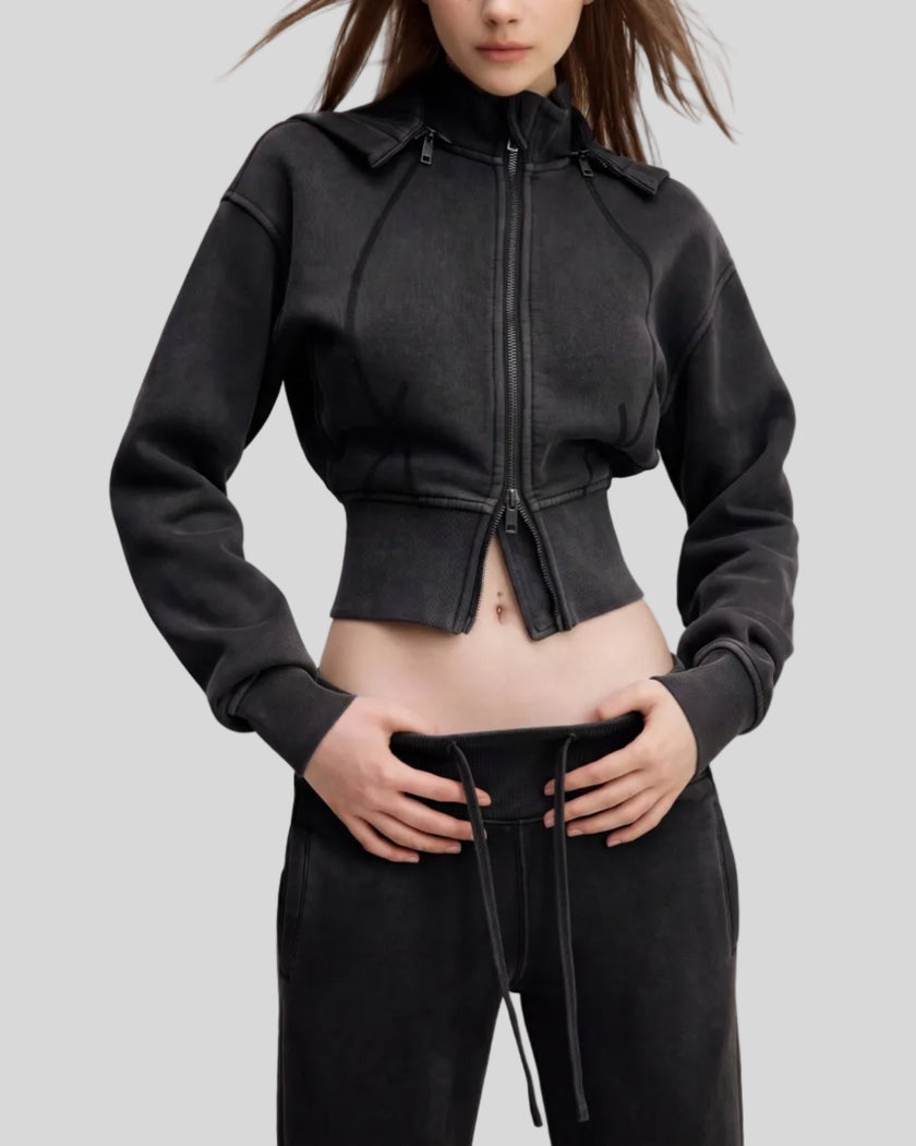 Angled front view of woman wearing cropped Vintage Washed Edition Hoodie with contoured seam details in Black