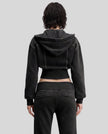 Upper body back view of woman wearing Vintage Washed Edition Hoodie with detachable hood in Black