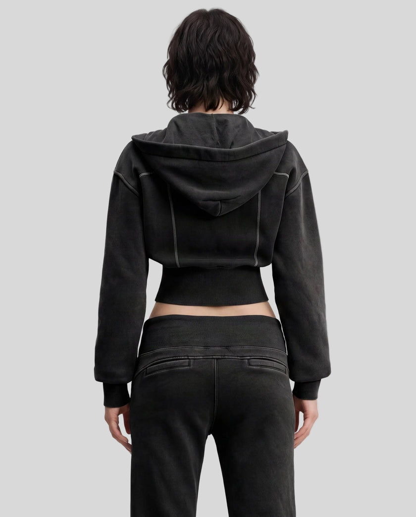 Upper body back view of woman wearing Vintage Washed Edition Hoodie with detachable hood in Black