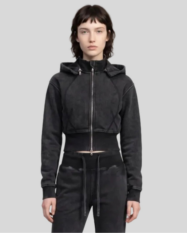 Upper body front view of woman wearing Vintage Washed Edition Hoodie in Black