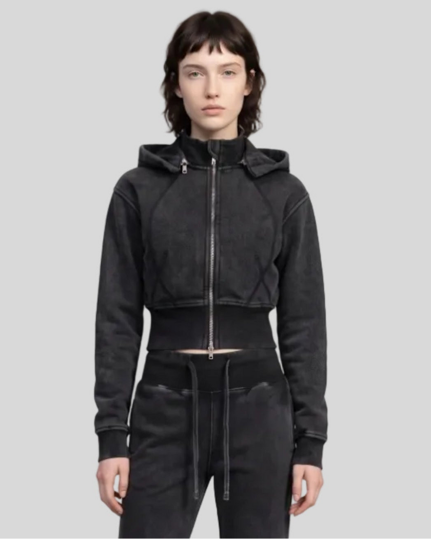 Upper body front view of woman wearing Vintage Washed Edition Hoodie in Black