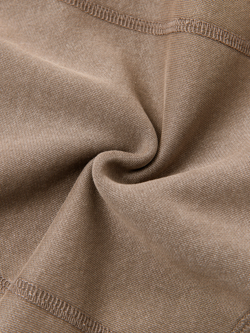 Closeup of vintage washed Coffee fabric texture and stitching on Vintage Washed Edition Hoodie