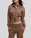 Angled front view of woman wearing cropped Vintage Washed Edition Hoodie with contoured seam details in Coffee