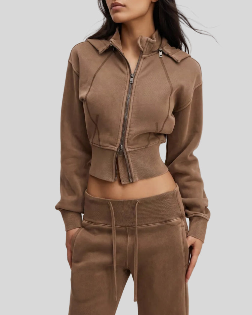 Angled front view of woman wearing cropped Vintage Washed Edition Hoodie with contoured seam details in Coffee